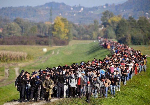 The Muslims invading Europe is guided by the police on the Balkans.