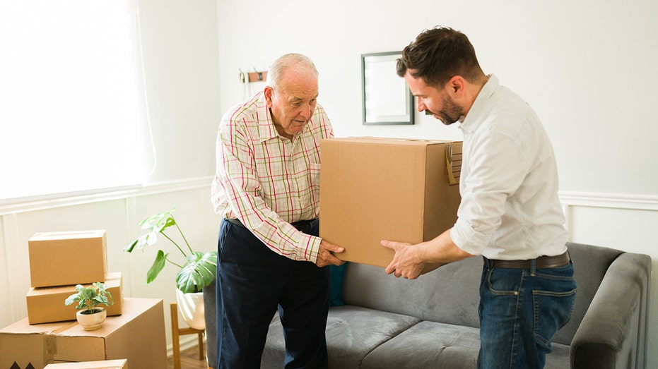 father son moving boxes One in three adults under 35 lives with parents amid housing shortage: report | Fox Business